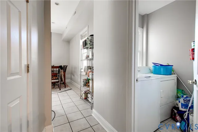 a view of a room that has a window and a chair in it