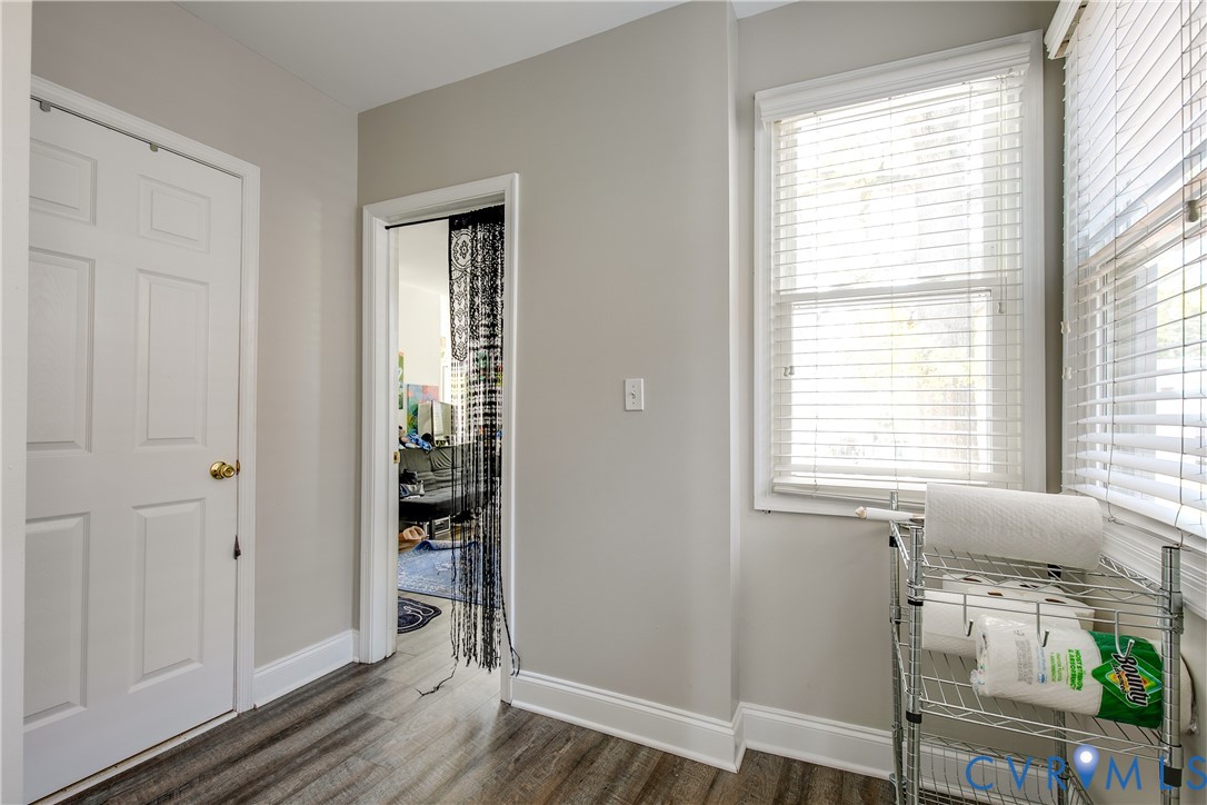 1237 West Cary Street Richmond, VA 23220 - Photo 18 of 23 a view of an empty room with wooden floor and a window