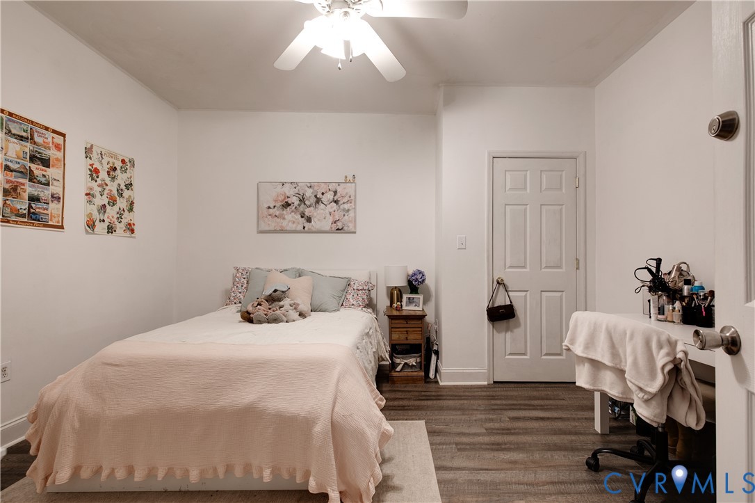 1237 West Cary Street Richmond, VA 23220 - Photo 21 of 23 a bedroom with bed and a chandelier
