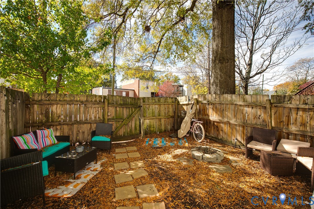 1237 West Cary Street Richmond, VA 23220 - Photo 22 of 23 a view of outdoor space with seating area and trees
