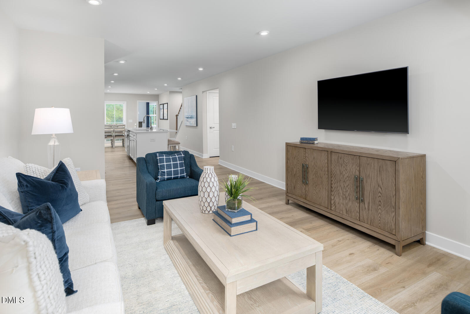 1337 Rollman Farm Road Raleigh, NC 27603 - Photo 11 of 22 a living room with furniture and a flat screen tv