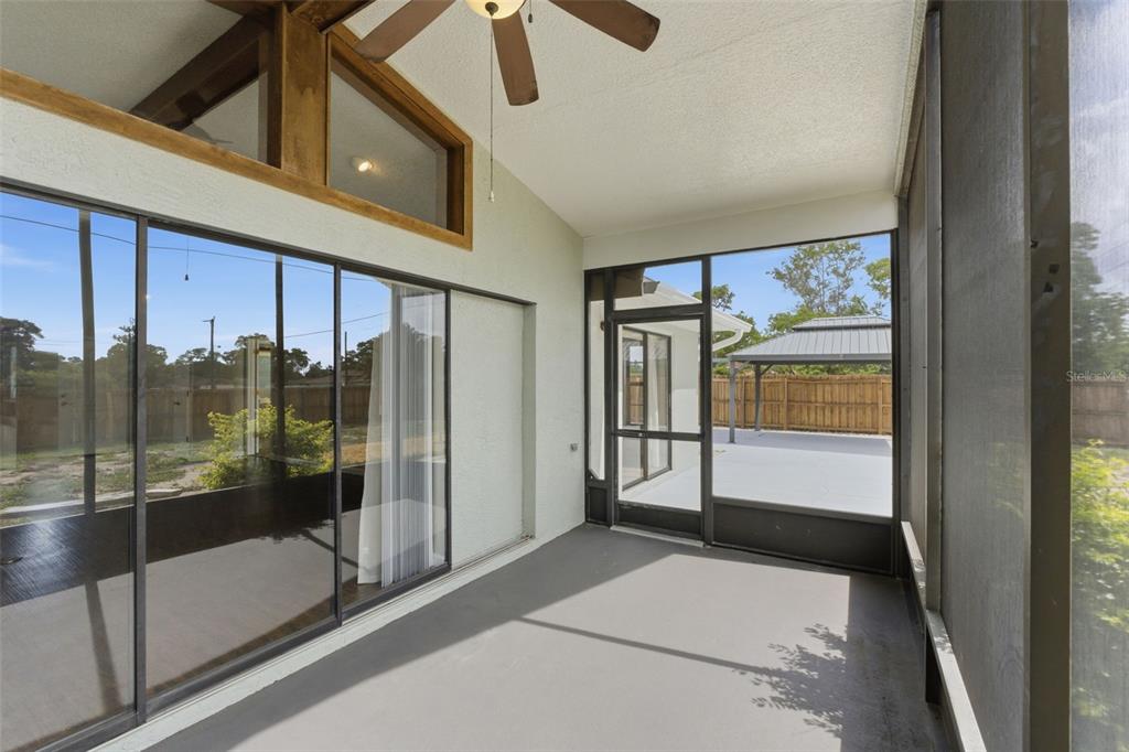 4966 Keysville Avenue Spring Hill, FL 34608 - Photo 40 of 48 a bathroom with a glass shower door and mirror
