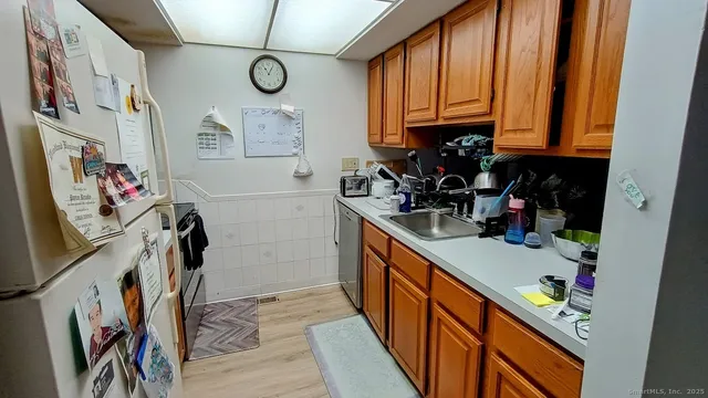 a bedroom with a bed and a large mirror