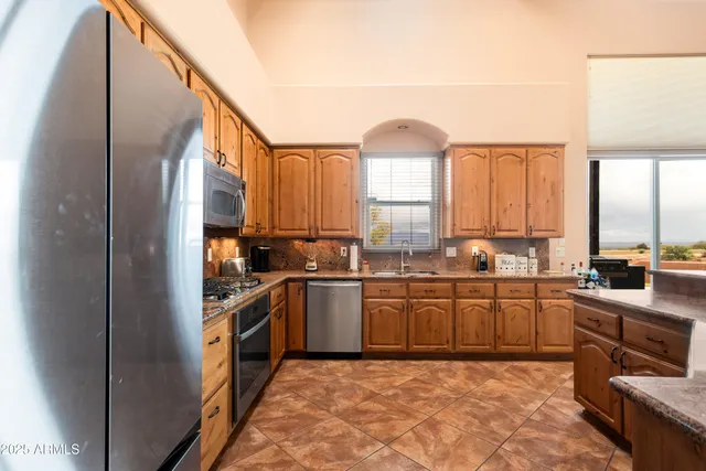 a bed room with a bed and a window