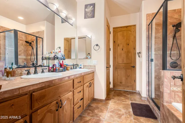 a view of walk in closet with clothes