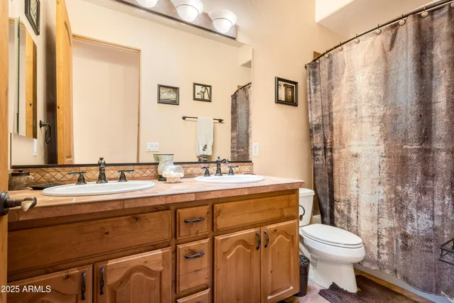 a bedroom with a bed and cabinets