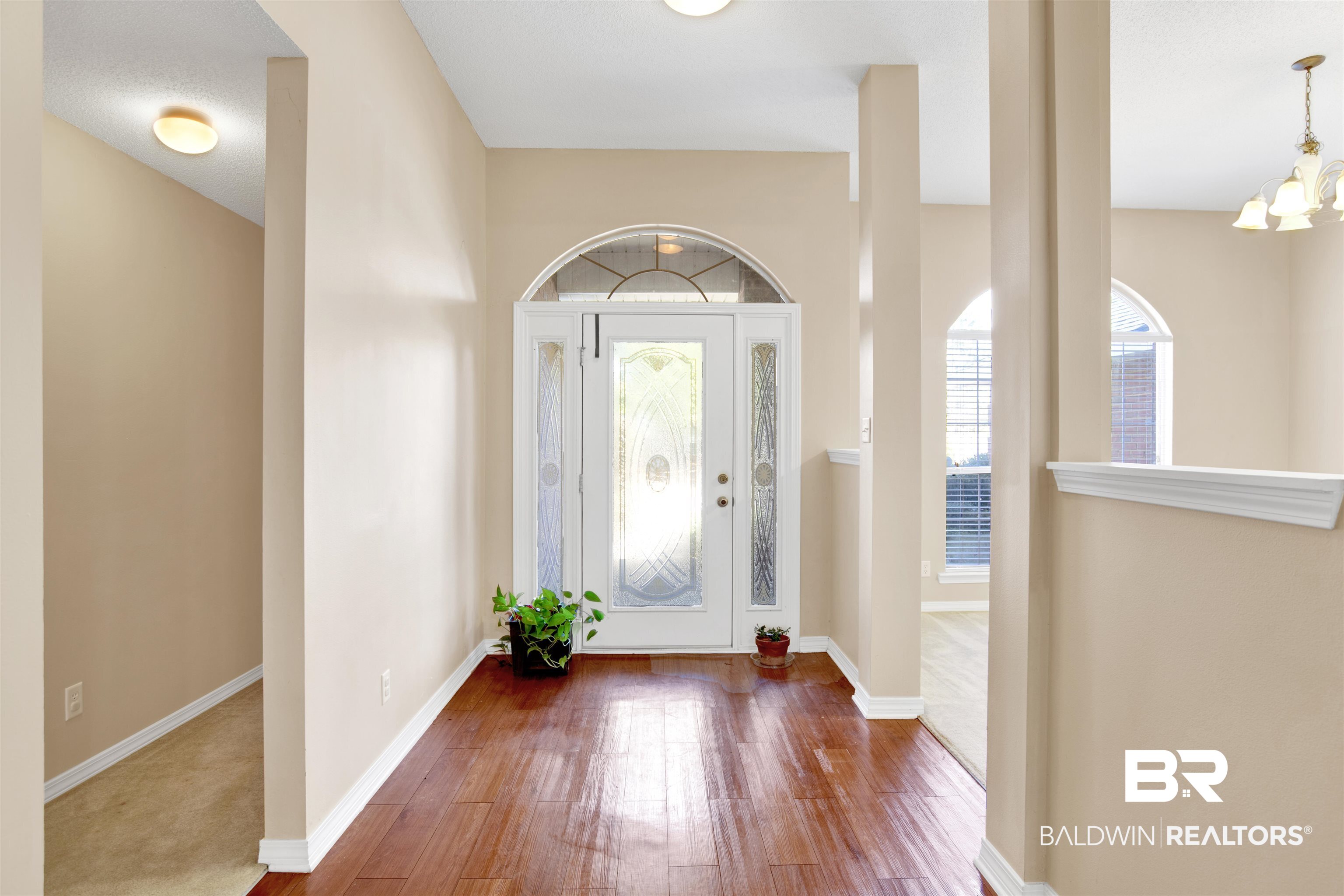 7297 Bridgemill Drive Mobile, AL 36619 - Photo 3 of 33 Entrance foyer featuring wood-type flooring and a chandelier