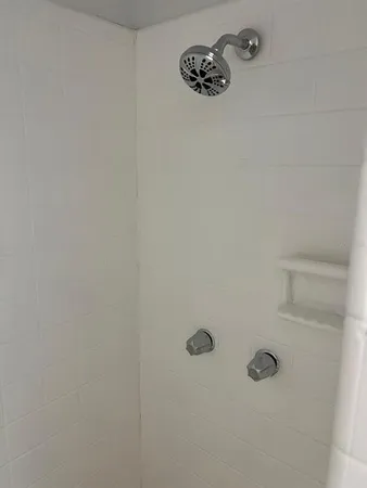 a bathroom with a shower and a sink