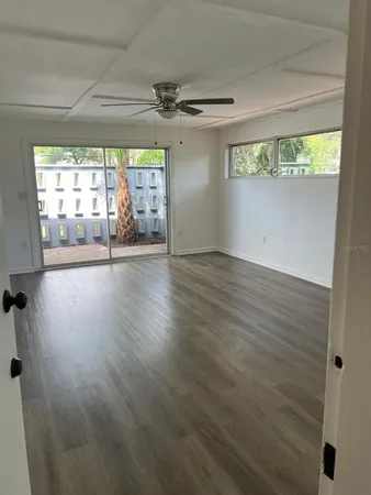 a view of a livingroom with wooden floor