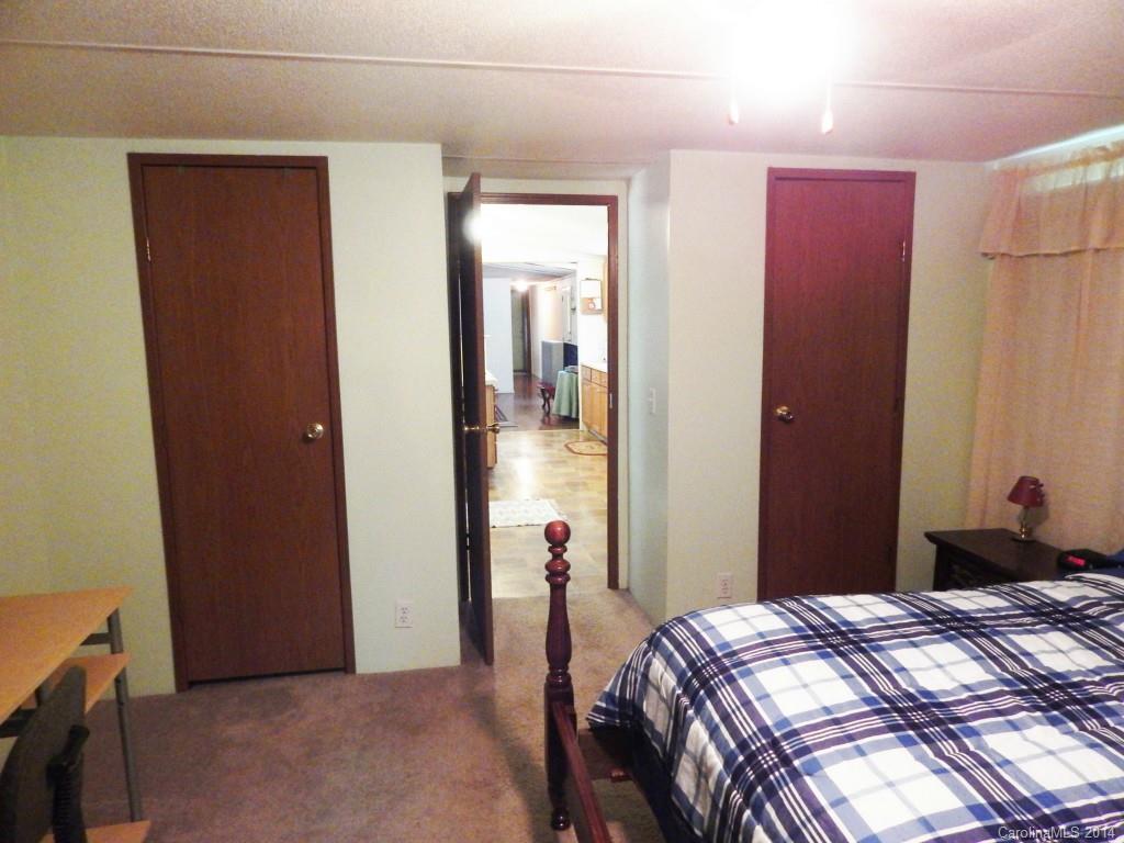 1830 Reservation Road Rock Hill, SC 29730 - Photo 11 of 24 a bedroom with bed and a mirror