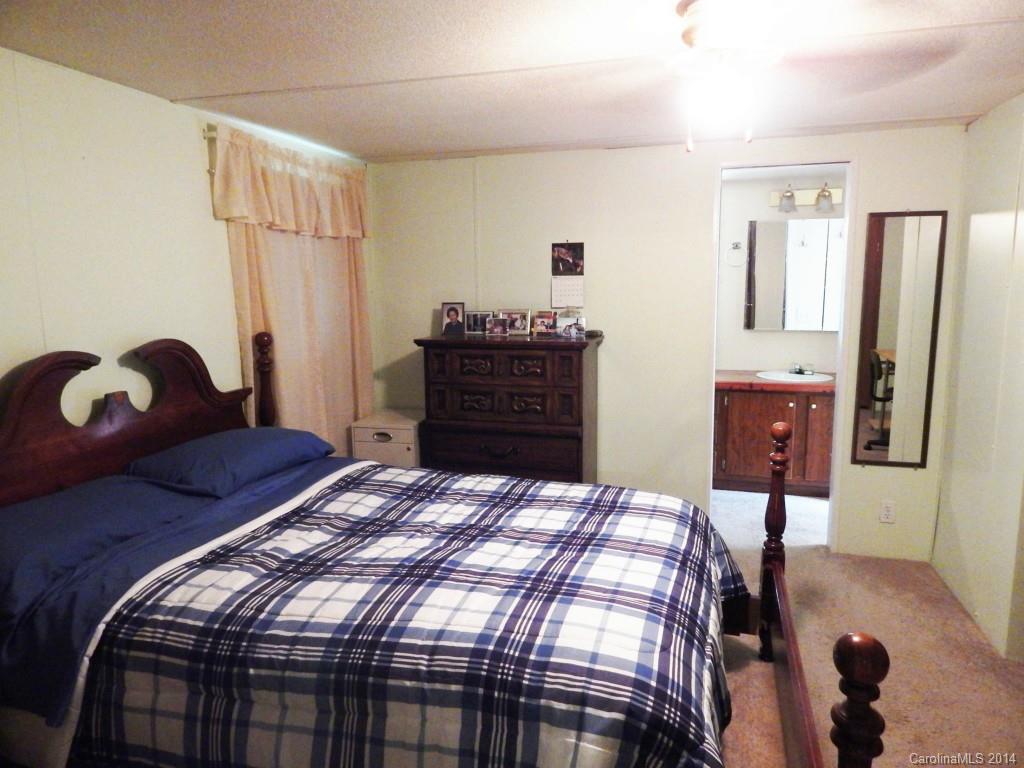 1830 Reservation Road Rock Hill, SC 29730 - Photo 8 of 24 a bedroom with a bed and wooden floor