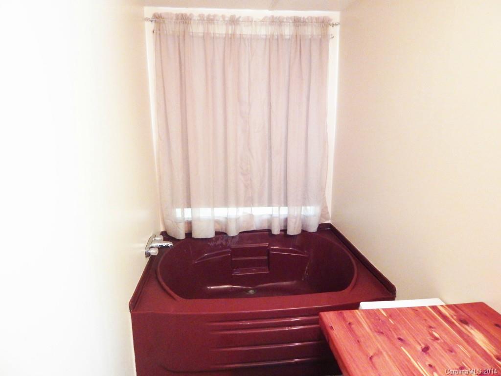 1830 Reservation Road Rock Hill, SC 29730 - Photo 9 of 24 a bath room with a bathtub and a window