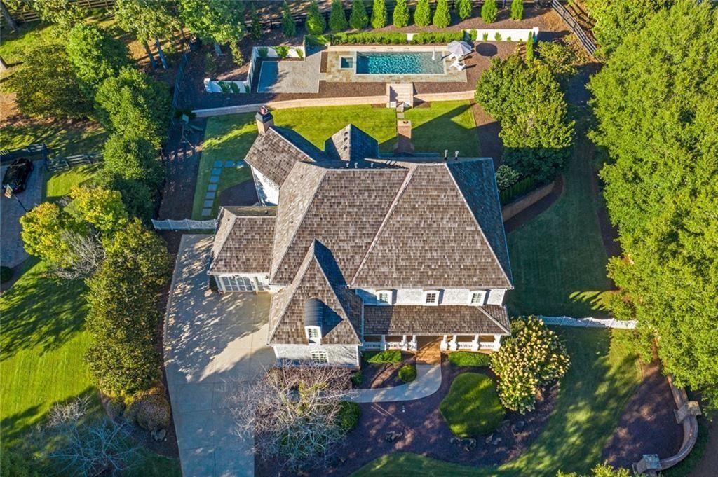 900 Crabapple Hill Alpharetta, GA 30004 - Photo 11 of 72 an aerial view of a house with swimming pool and large trees