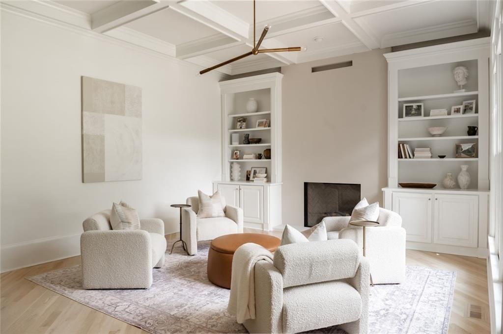 900 Crabapple Hill Alpharetta, GA 30004 - Photo 25 of 72 a living room with furniture a fireplace and a flat screen tv