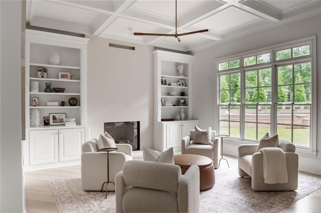 900 Crabapple Hill Alpharetta, GA 30004 - Photo 28 of 72 a living room with furniture a flat screen tv and a large window