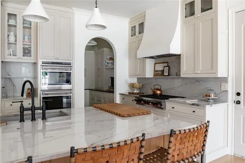 a living room with furniture fireplace and flat screen tv