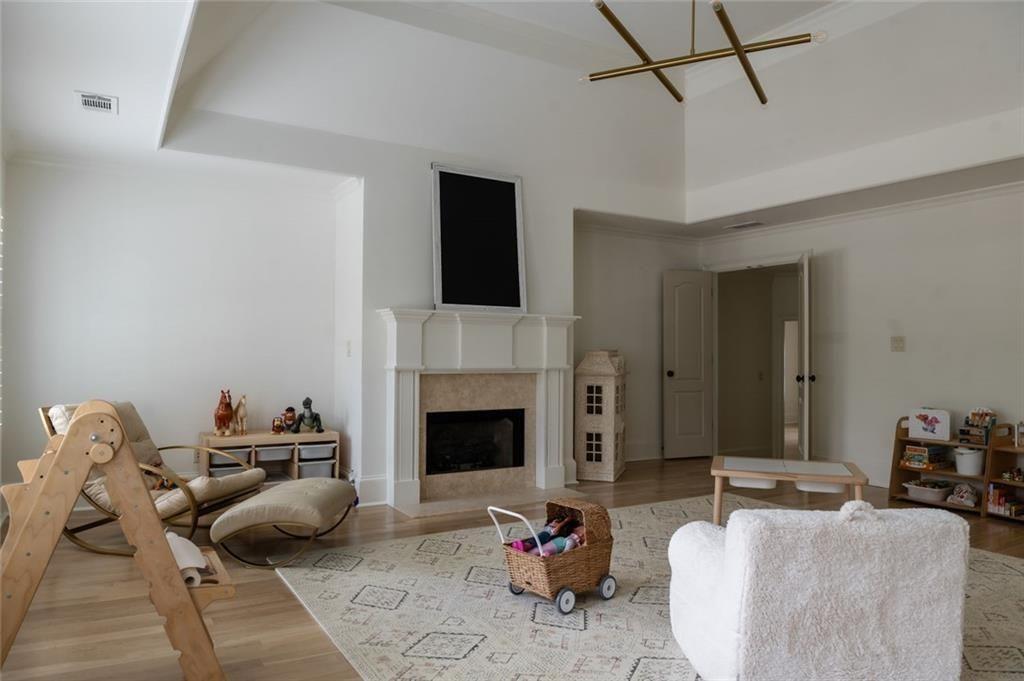 900 Crabapple Hill Alpharetta, GA 30004 - Photo 46 of 72 a living room with furniture and a fireplace