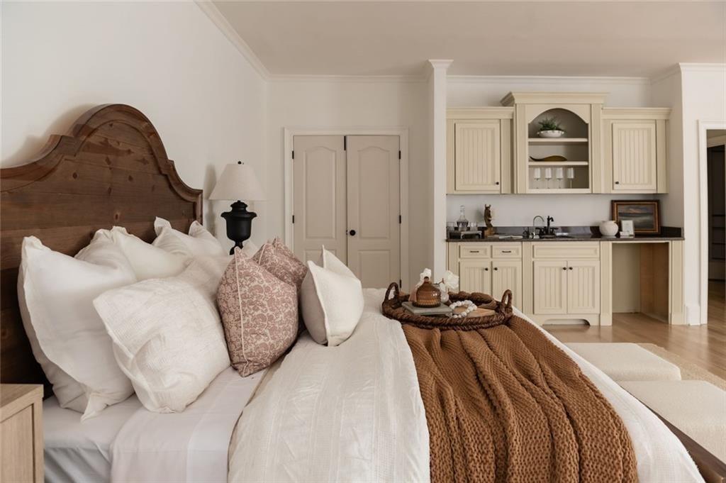 900 Crabapple Hill Alpharetta, GA 30004 - Photo 52 of 72 a bedroom with a bed and a chair