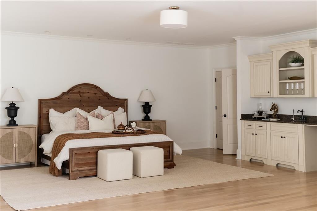 900 Crabapple Hill Alpharetta, GA 30004 - Photo 53 of 72 a bedroom with a bed and a chandelier