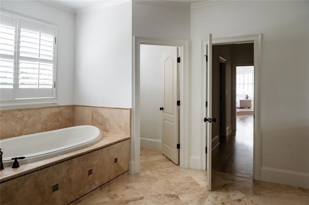 900 Crabapple Hill Alpharetta, GA 30004 - Photo 58 of 72 a bathroom with a tub and a sink