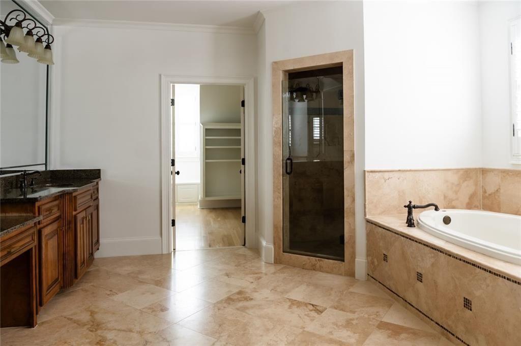 900 Crabapple Hill Alpharetta, GA 30004 - Photo 60 of 72 a spacious bathroom with a tub sink and mirror