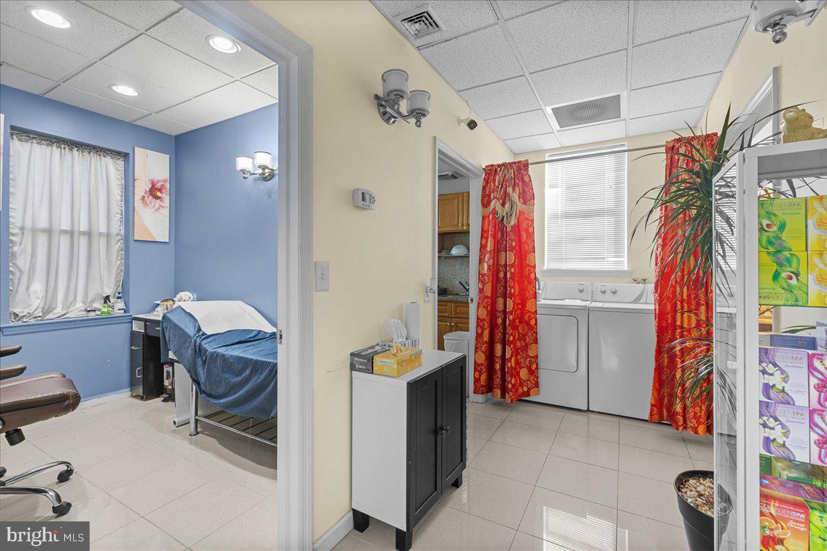 94 East Browning Road Bellmawr, NJ 08031 - Photo 11 of 39 a view of a workspace with furniture and a window