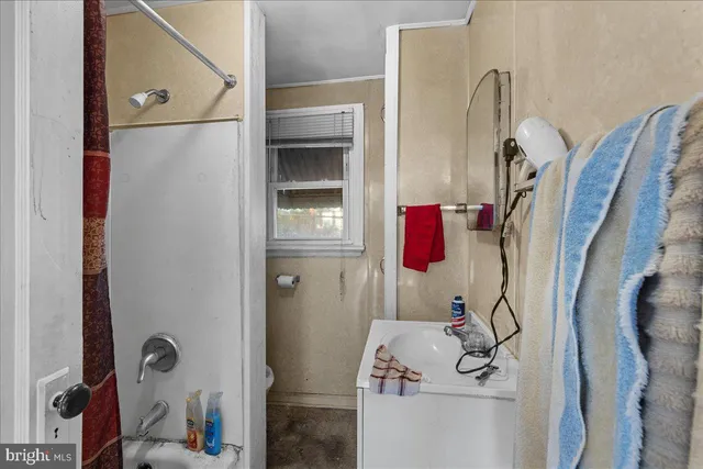 a bed room with a bed and a window