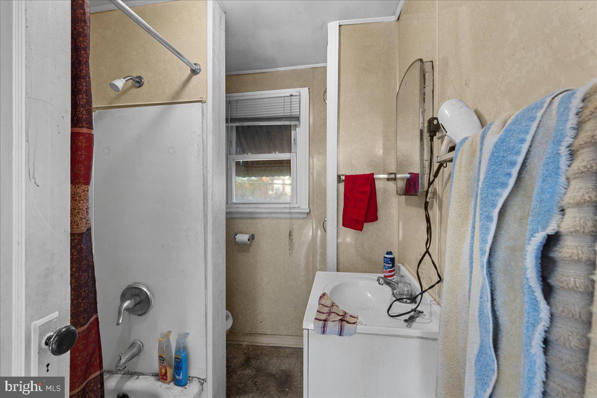 94 East Browning Road Bellmawr, NJ 08031 - Photo 22 of 39 a bathroom with a bathtub and shower