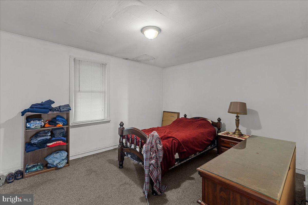 94 East Browning Road Bellmawr, NJ 08031 - Photo 23 of 39 a bed room with a bed and a window