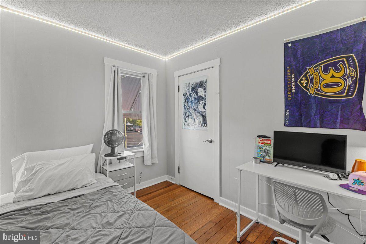 94 East Browning Road Bellmawr, NJ 08031 - Photo 30 of 39 a bedroom with a bed and flat screen tv