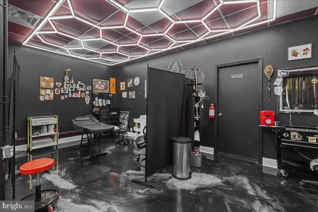 a bathroom with a toilet a sink and a shower curtain