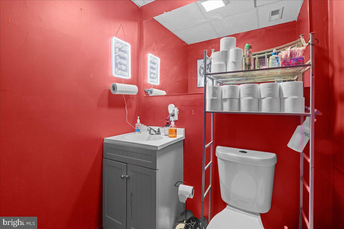 94 East Browning Road Bellmawr, NJ 08031 - Photo 39 of 39 a bathroom with a toilet a sink and a shower curtain