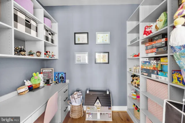 a living room with furniture a lamp and a floor to ceiling window
