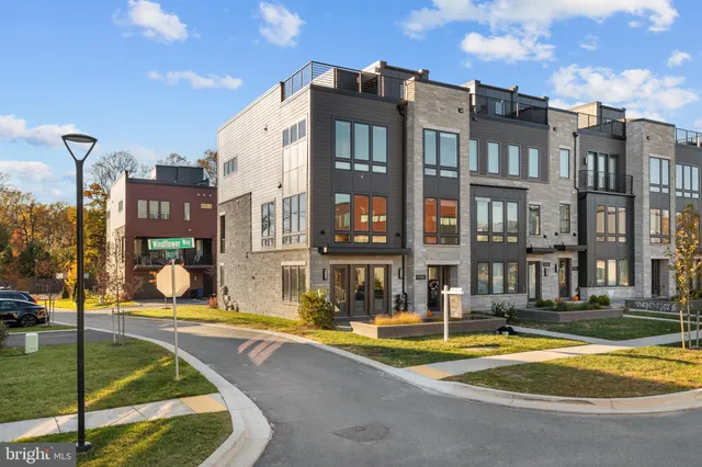 a front view of a house with outdoor seating