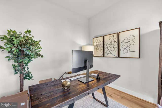 a large kitchen with kitchen island a large counter space a sink appliances and cabinets