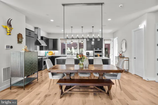 a white toilet sitting next to a bathroom sink