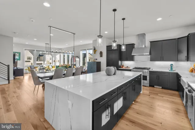 a spacious bathroom with a double vanity sink mirror and a bath tub