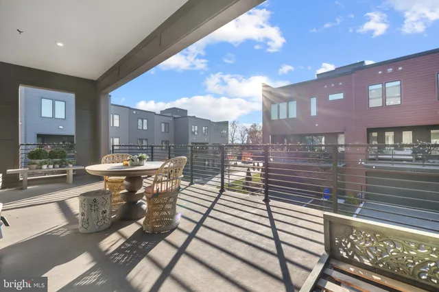 a bathroom with a double vanity sink toilet mirror and bathtub