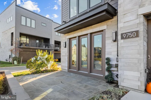 a view of entryway with wooden floor and stairs