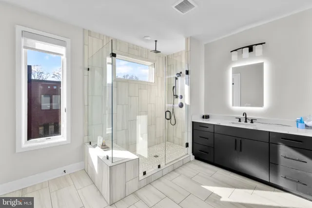 a view of a swimming pool with outdoor seating and plants