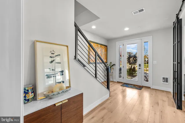 a bathroom with a double vanity sink toilet mirror and shower