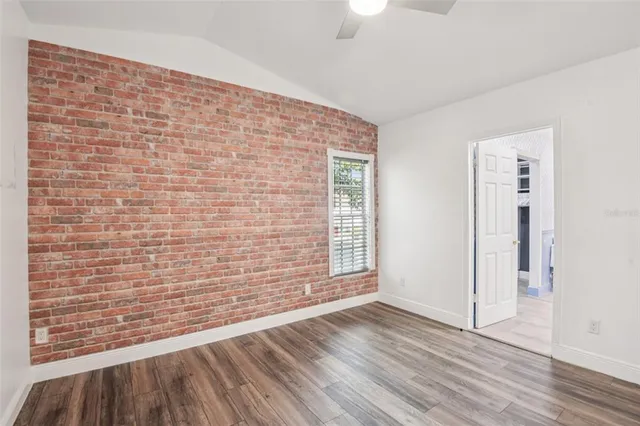 a spacious bathroom with a double vanity sink mirror and shower