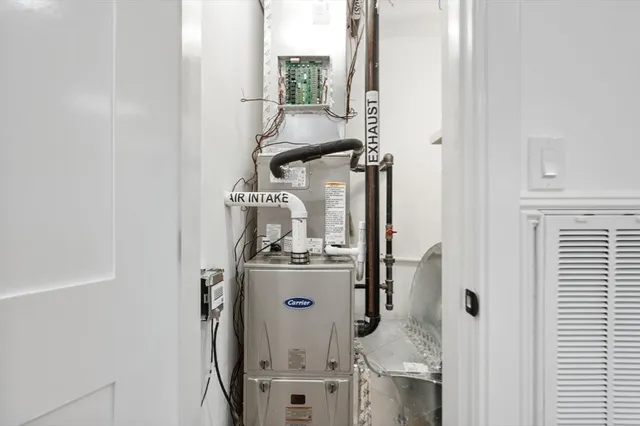 a picture of a room with furniture and white walls