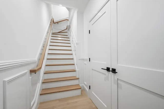 a bathroom with a glass shower door