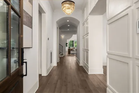 a view of hallway with wooden floor