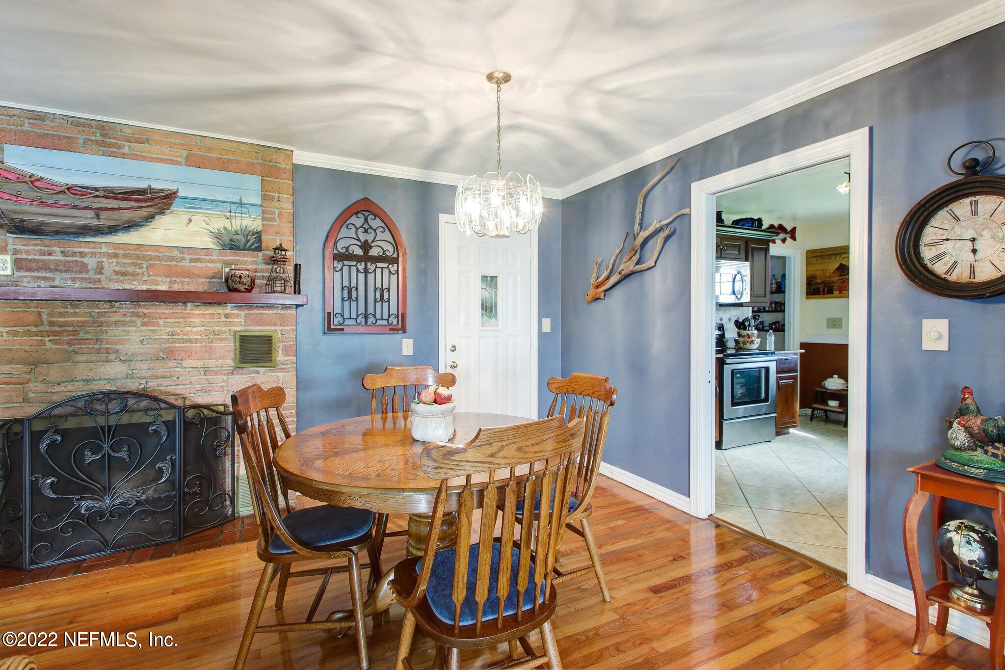101 Orange Street Satsuma, FL 32189 - Photo 13 of 67 a view of a dining room with furniture and chandelier