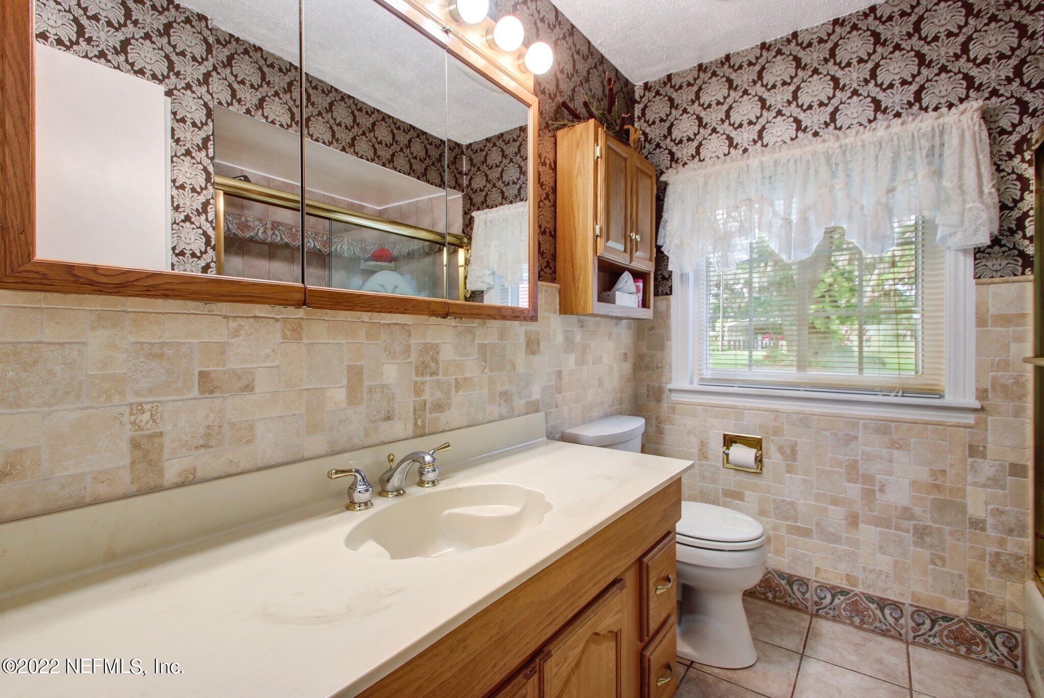 101 Orange Street Satsuma, FL 32189 - Photo 17 of 67 a bathroom with a sink and a toilet