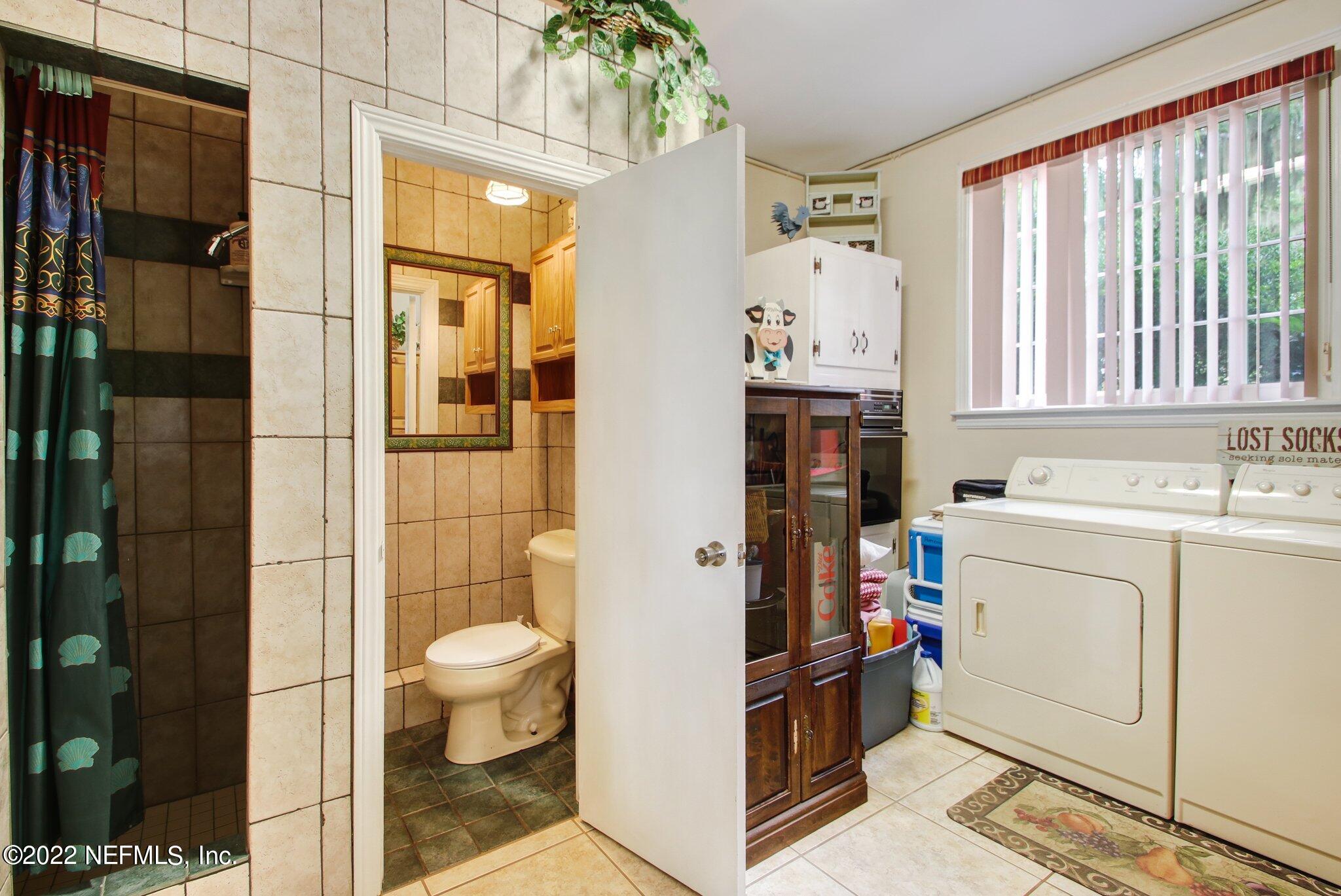 101 Orange Street Satsuma, FL 32189 - Photo 18 of 67 a bathroom with a sink a toilet and shower