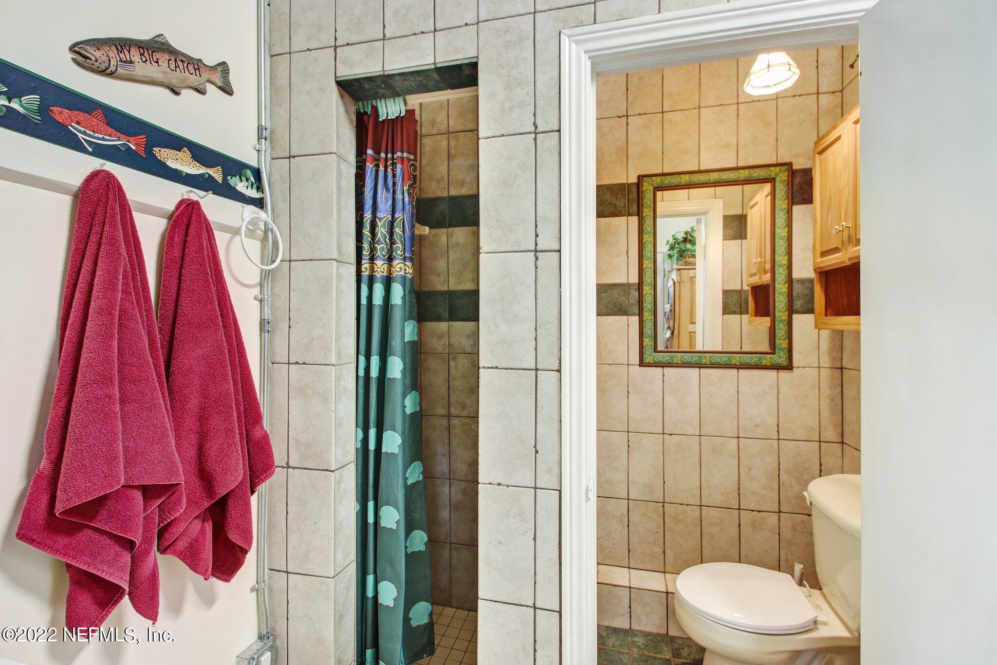 101 Orange Street Satsuma, FL 32189 - Photo 19 of 67 a bathroom with a toilet and a shower