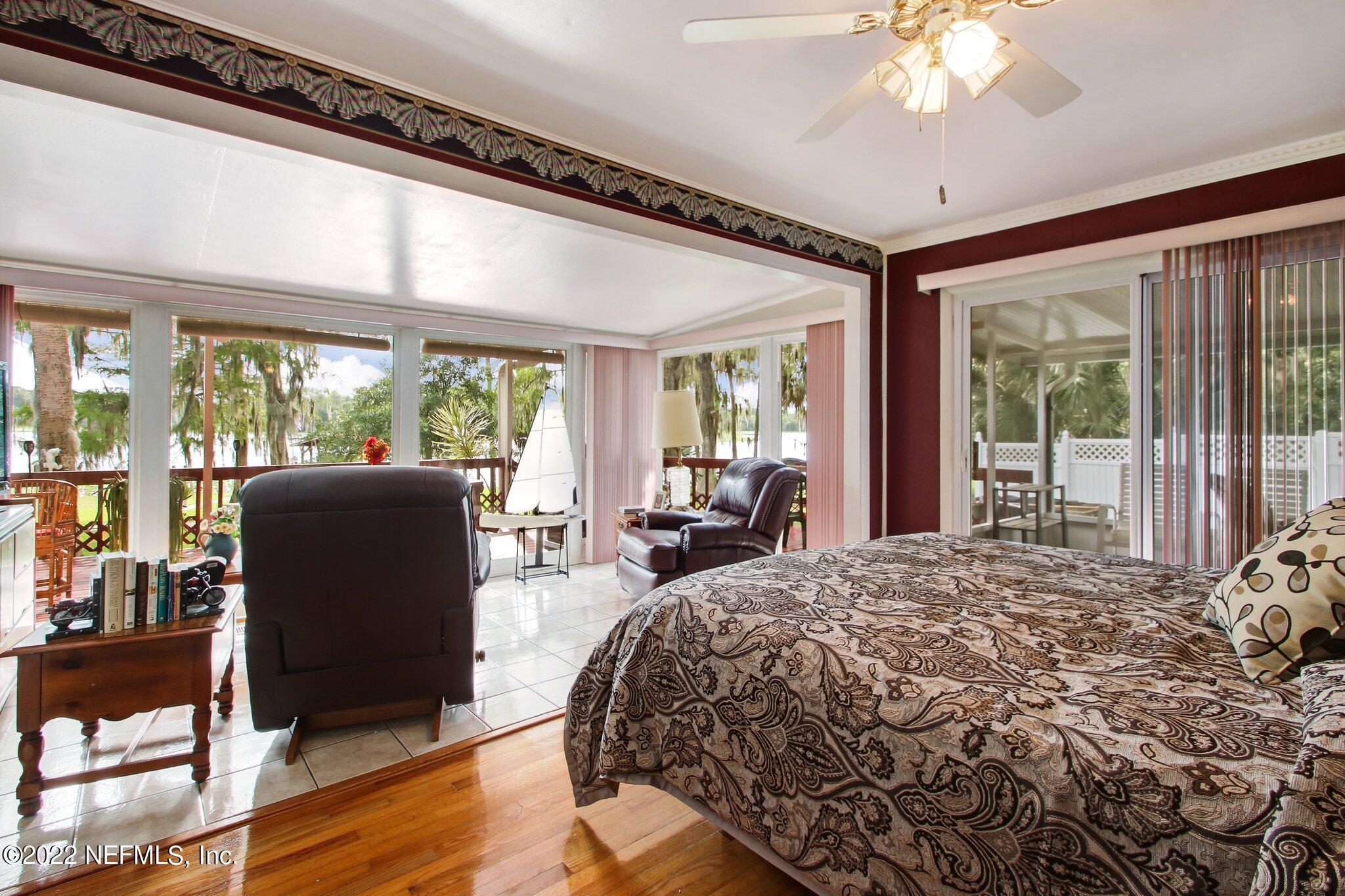 101 Orange Street Satsuma, FL 32189 - Photo 20 of 67 a bedroom with a bed and wooden floor